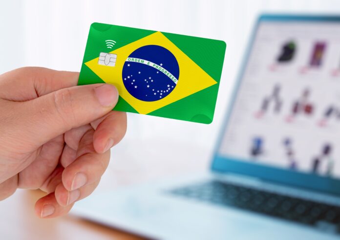 Hands,Holding,Plastic,Credit,Card,And,Using,Laptop.,Online,Shopping